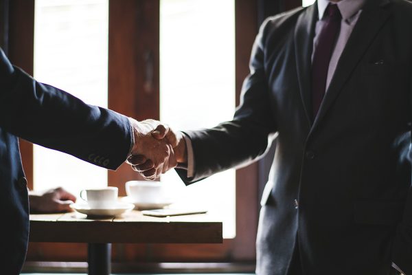 Business people shaking hands in a meeting room